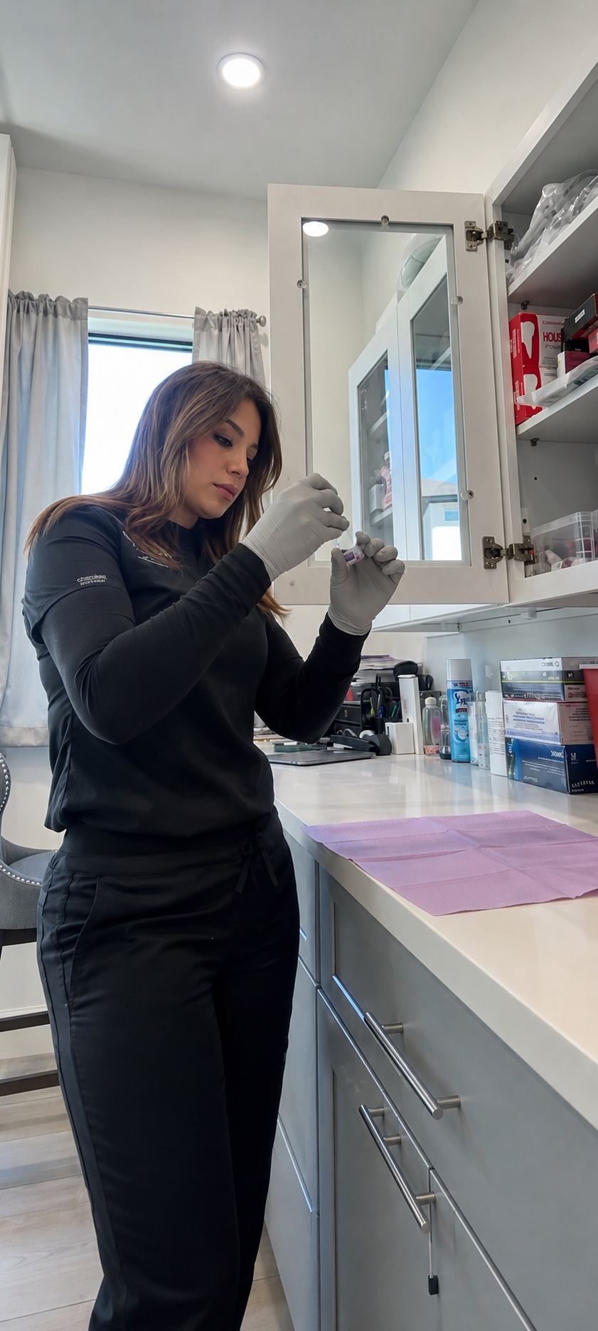Rana, founder of Skinovation Aesthetics, preparing an injectable treatment in the clinic