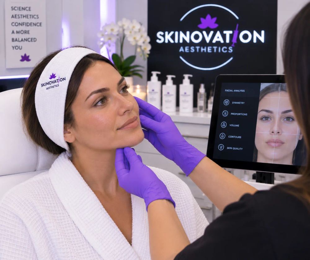 Skinovation Aesthetics provider explaining facial balancing treatment options and benefits to a client