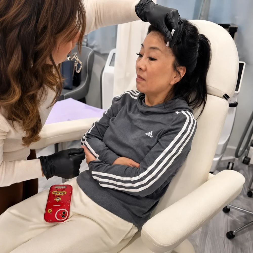 Aesthetic provider discussing a personalized injectable treatment plan with a client